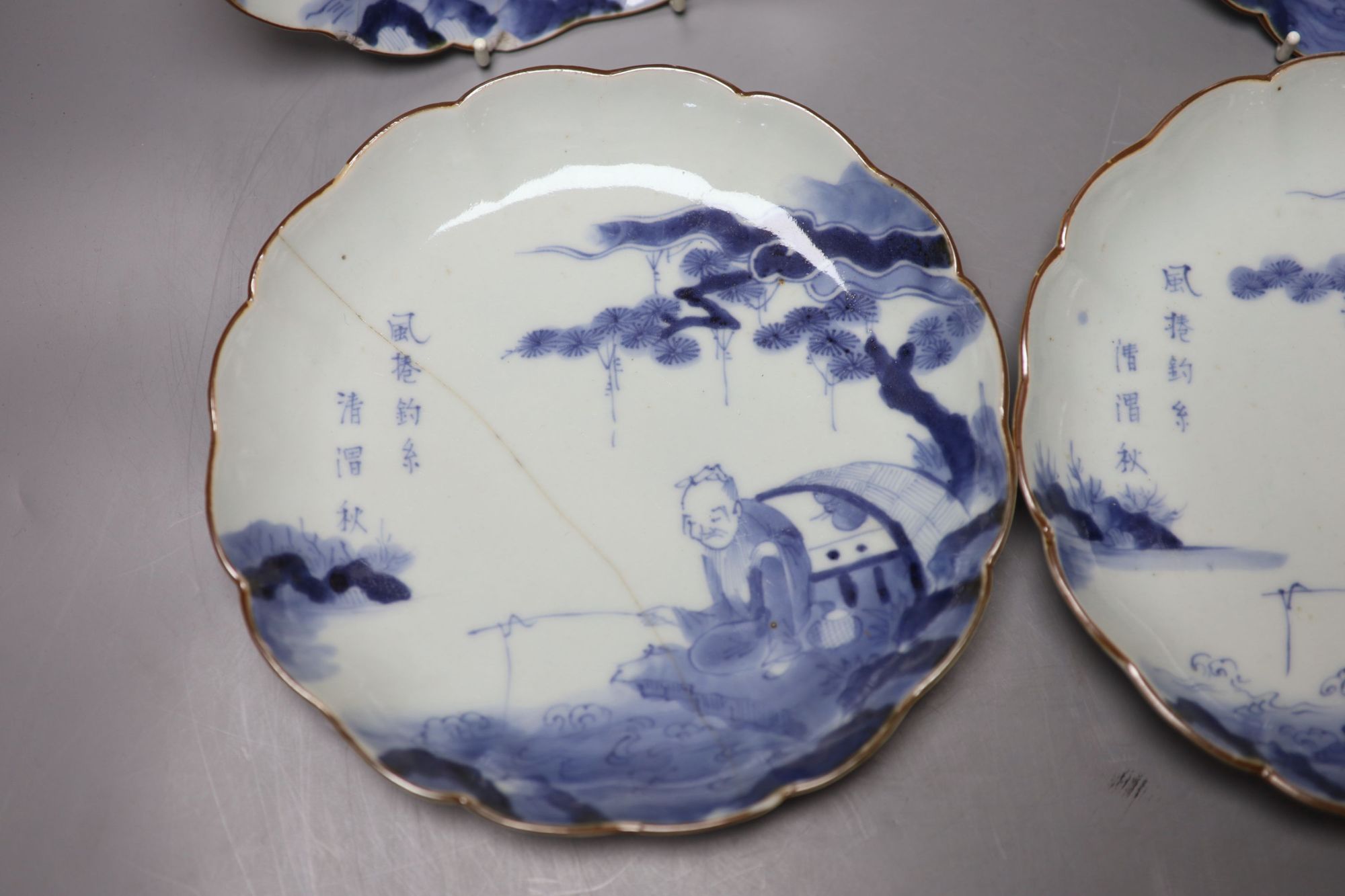 A set of four 17th century Japanese Arita blue and white plates, diameter 21cm